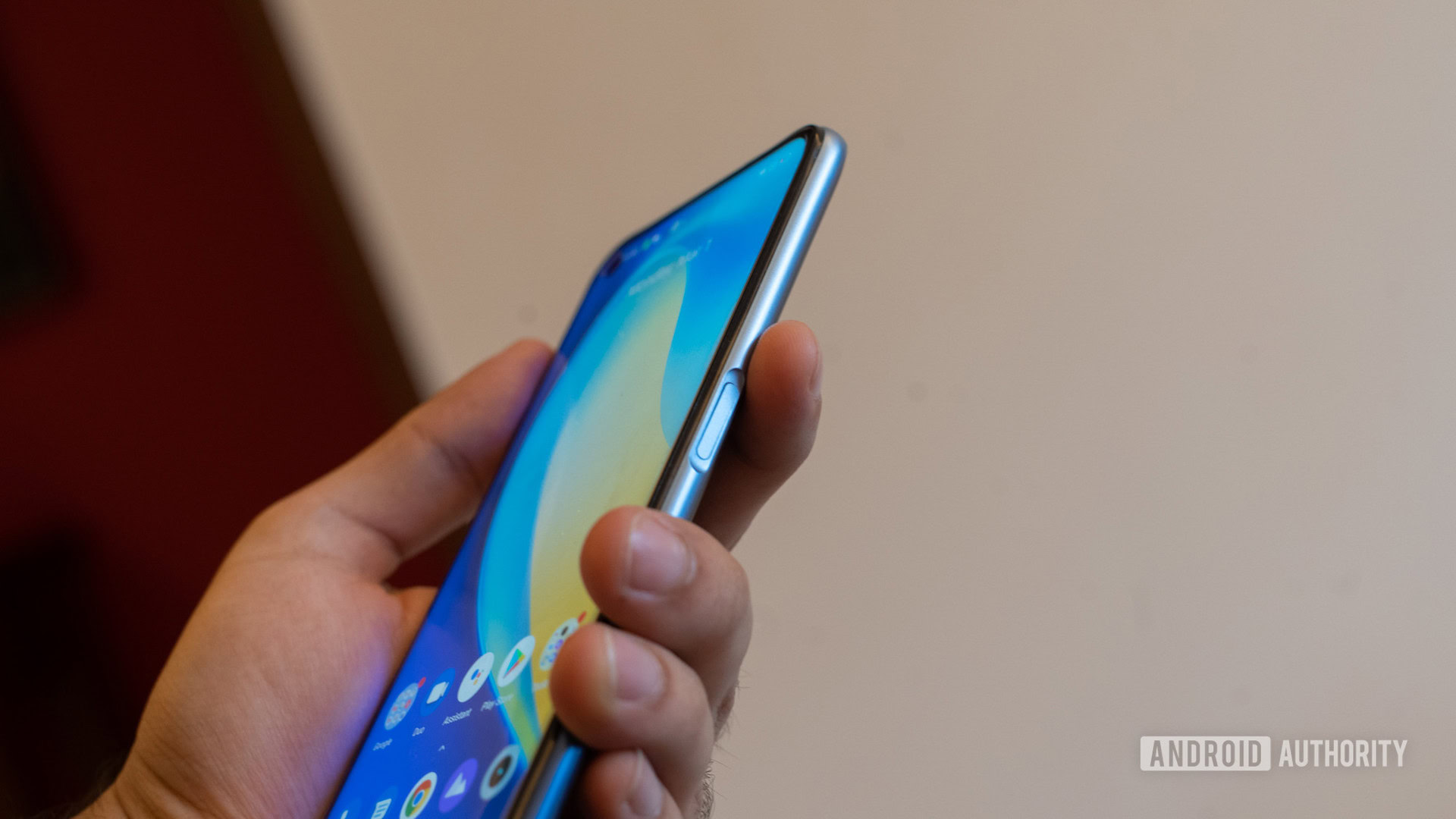 realme Narzo 30 Pro in hand showing fingerprint scanner