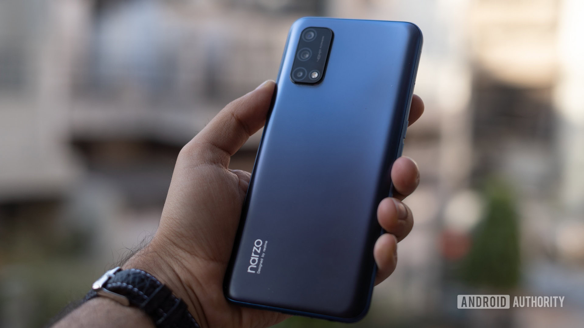 realme Narzo 30 Pro review in hand with camera and logo