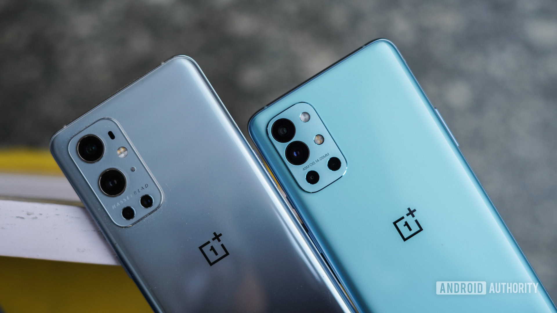 The rear of the OnePlus 9R next to the OnePlus 9 Pro.