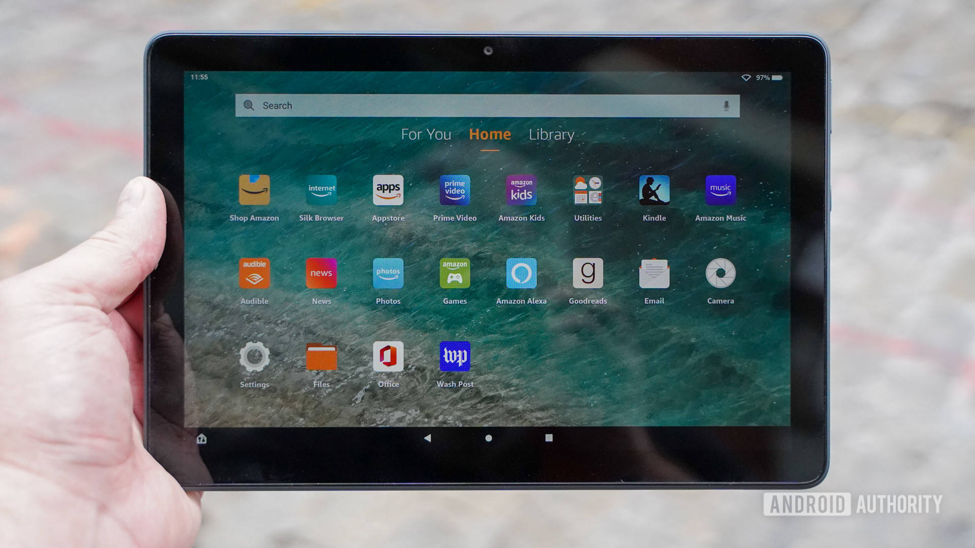 The Amazon Fire HD 10 Plus in the hand.
