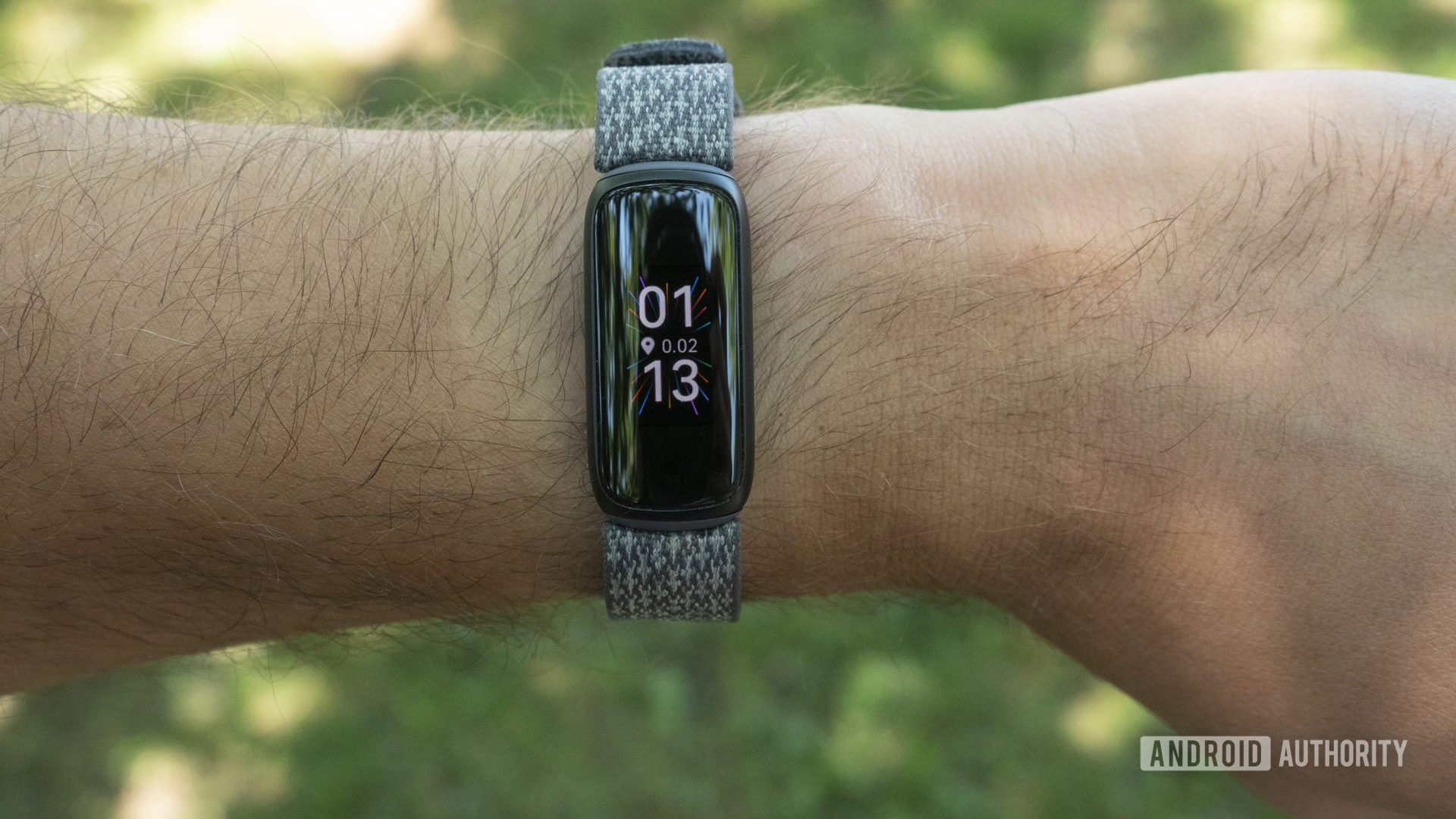 fitbit luxe review on wrist watch face slate woven strap