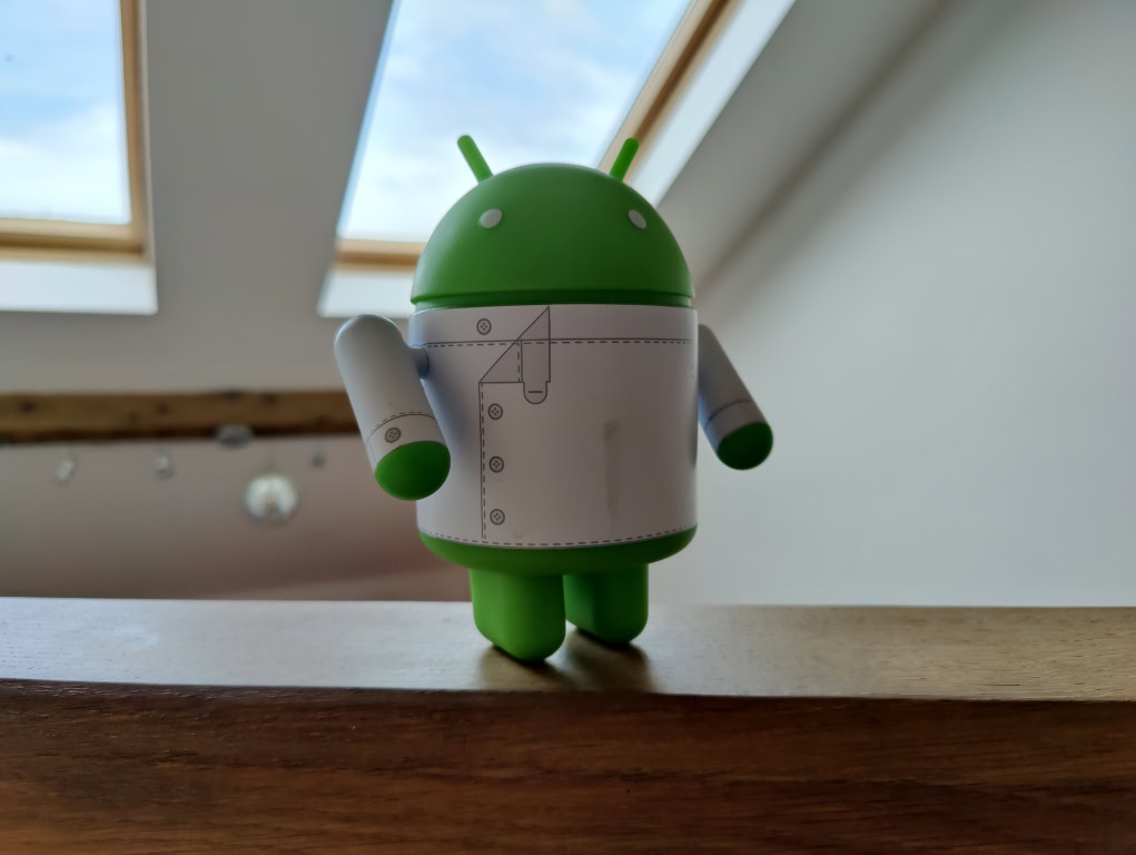 HDR picture of Android figurine with skylight in the back OnePlus 9 Pro