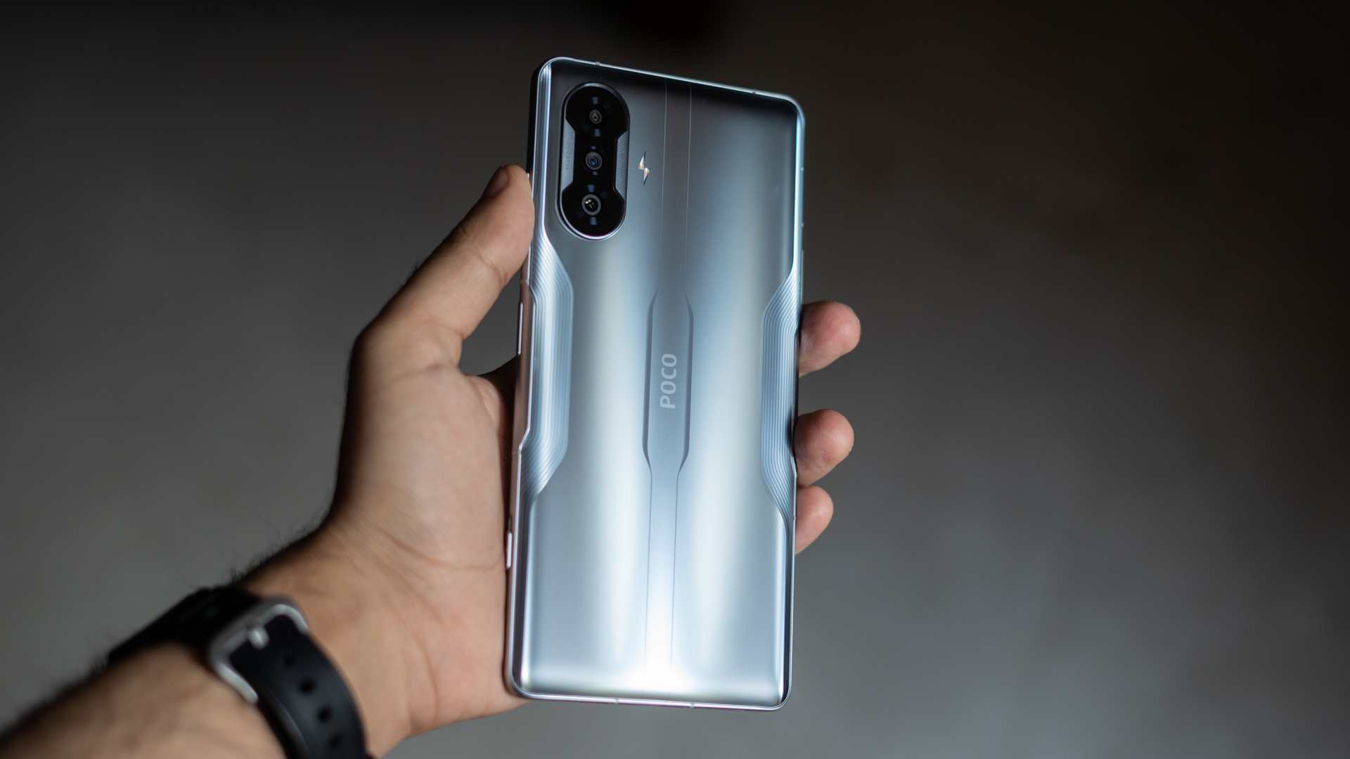POCO F3 GT showing back of phone in hand
