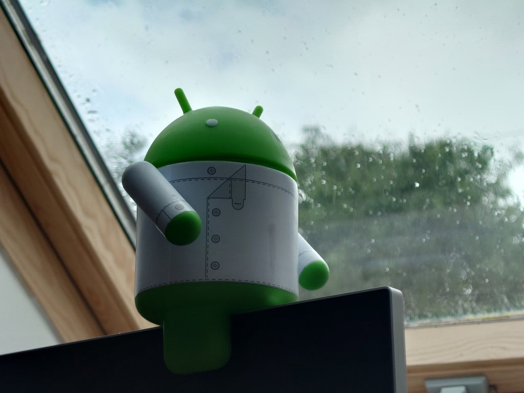 Sony Xperia 1 III camera sample shot of a Bugdroid figure in front of a window.
