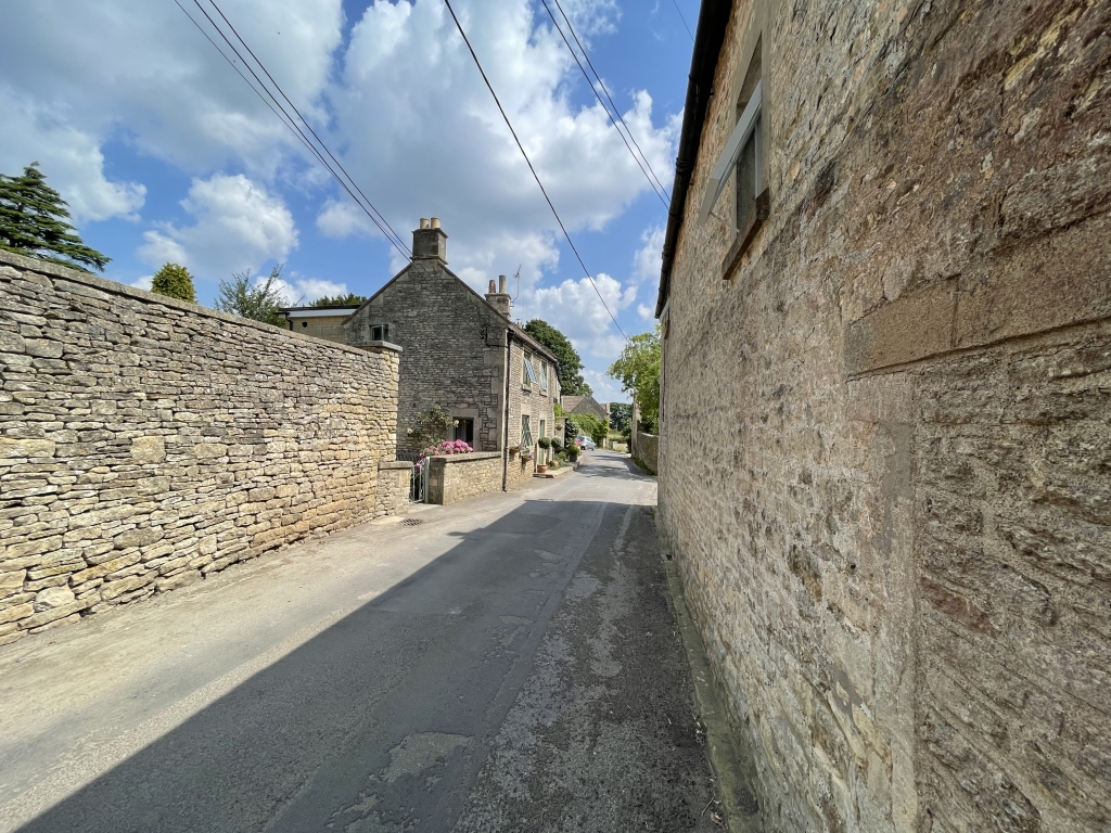 Wide angle picture of stone houses with blue sky shot on Apple iPhone 12 Pro Max