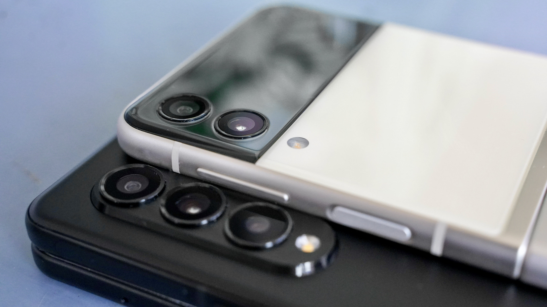 Samsung Galaxy Z Fold vs Z Flip camera closeup showing the rear camera module on both phones.