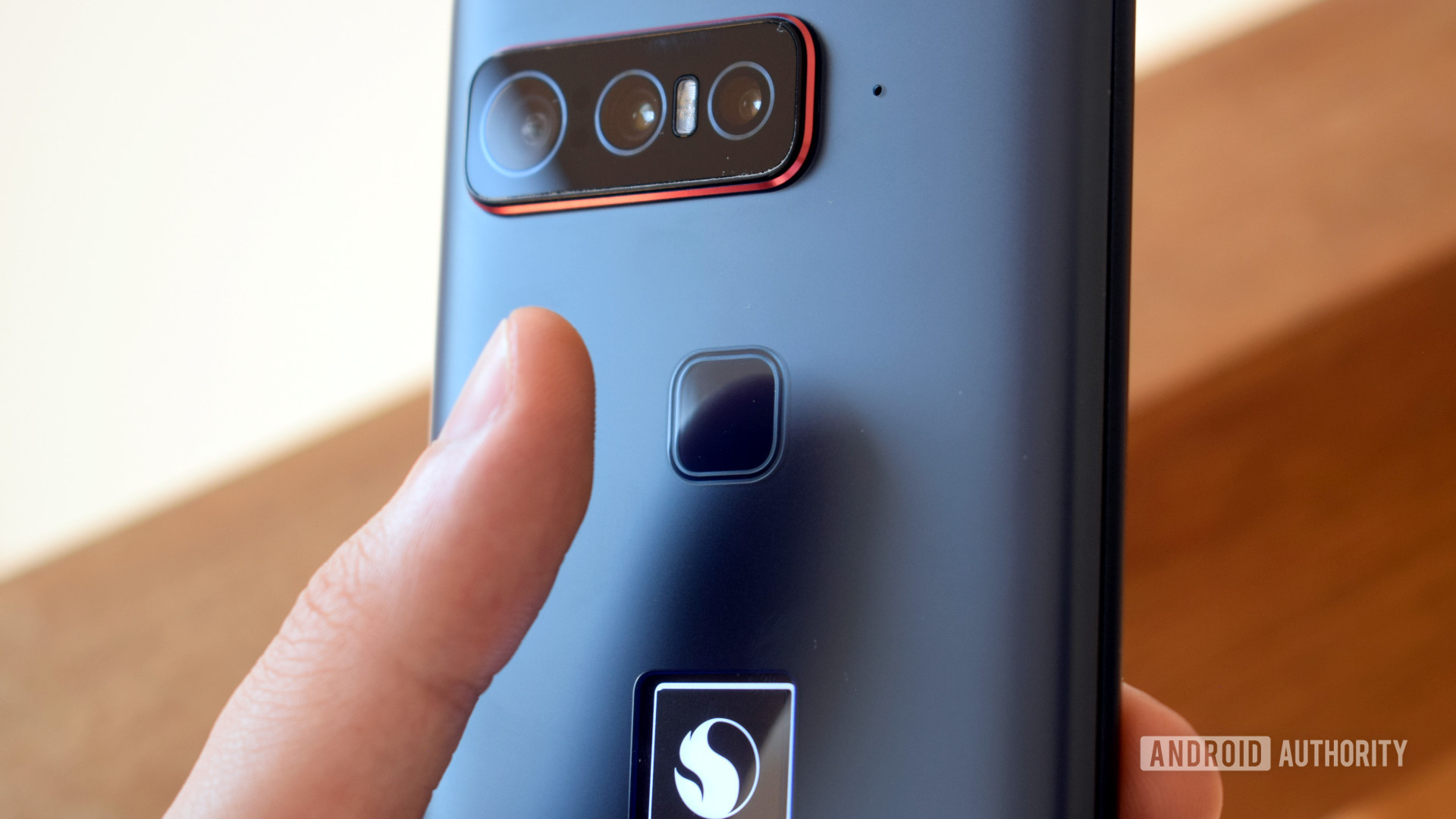 Smartphone for Snapdragon Insiders finger hovering over fingerprint scanner