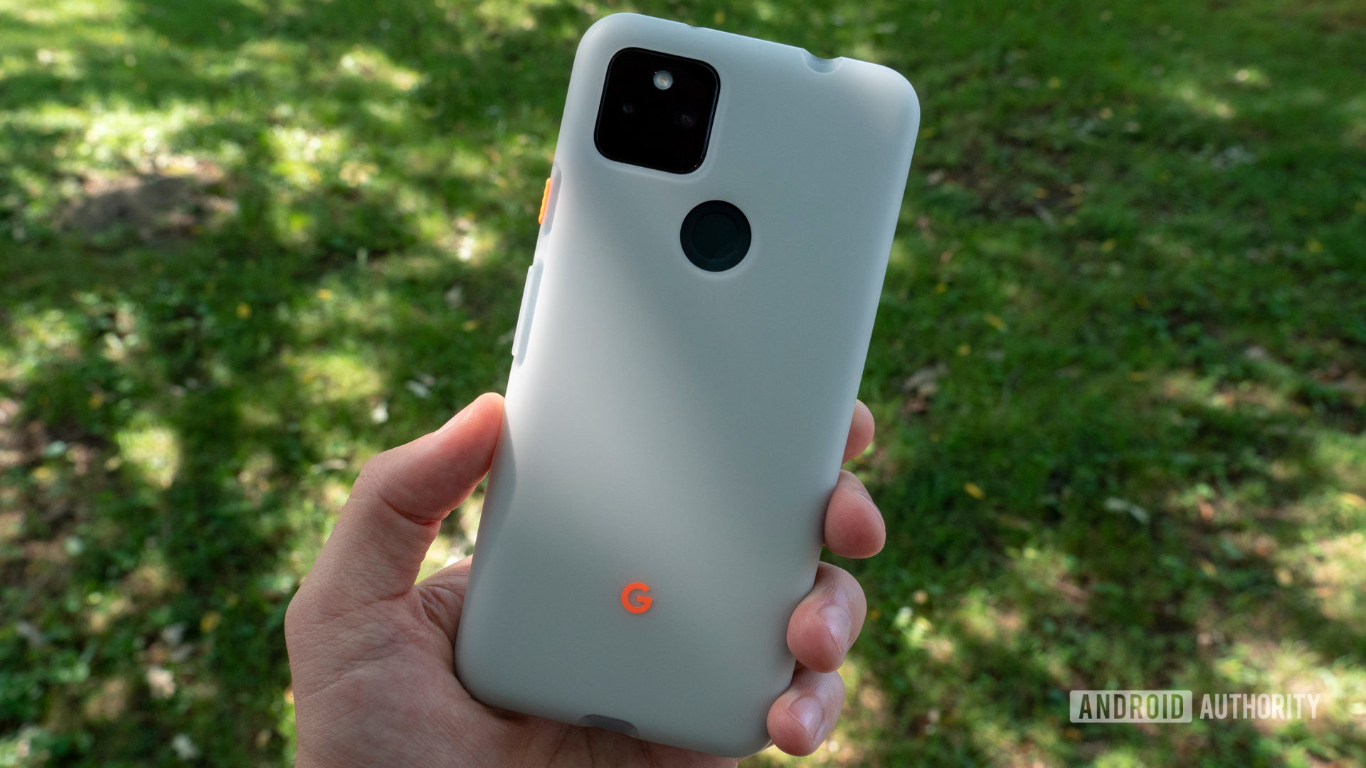 the google pixel 5a in maybe moon case being held in a hand