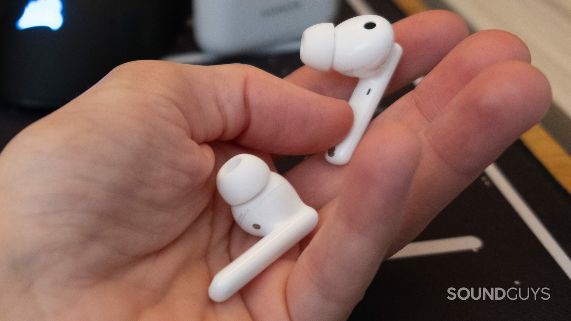 An image of the Honor Earbuds 2 Lite in hand without the case