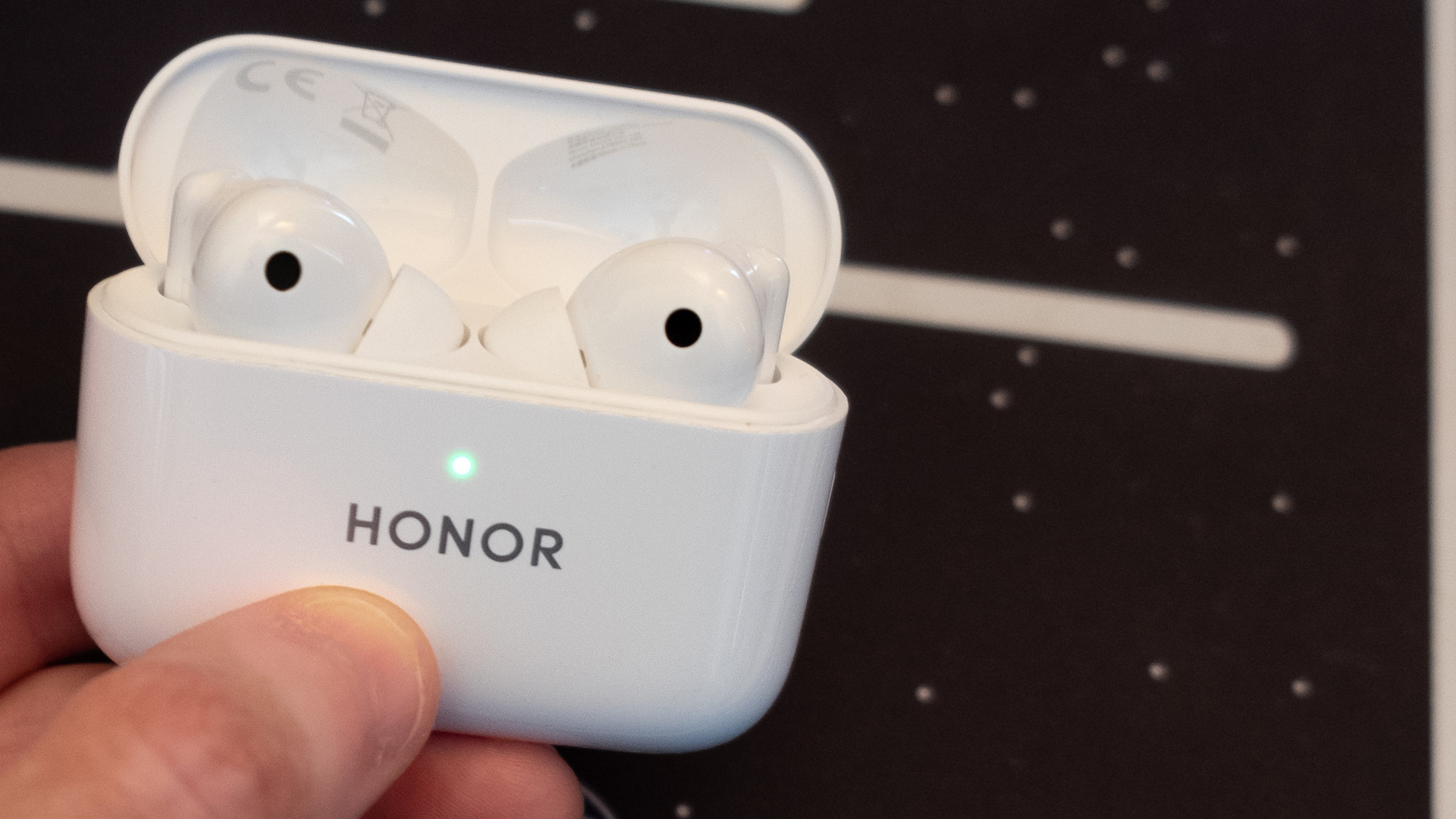 An image of the Honor Earbuds 2 Lite in the charging case with the lid open
