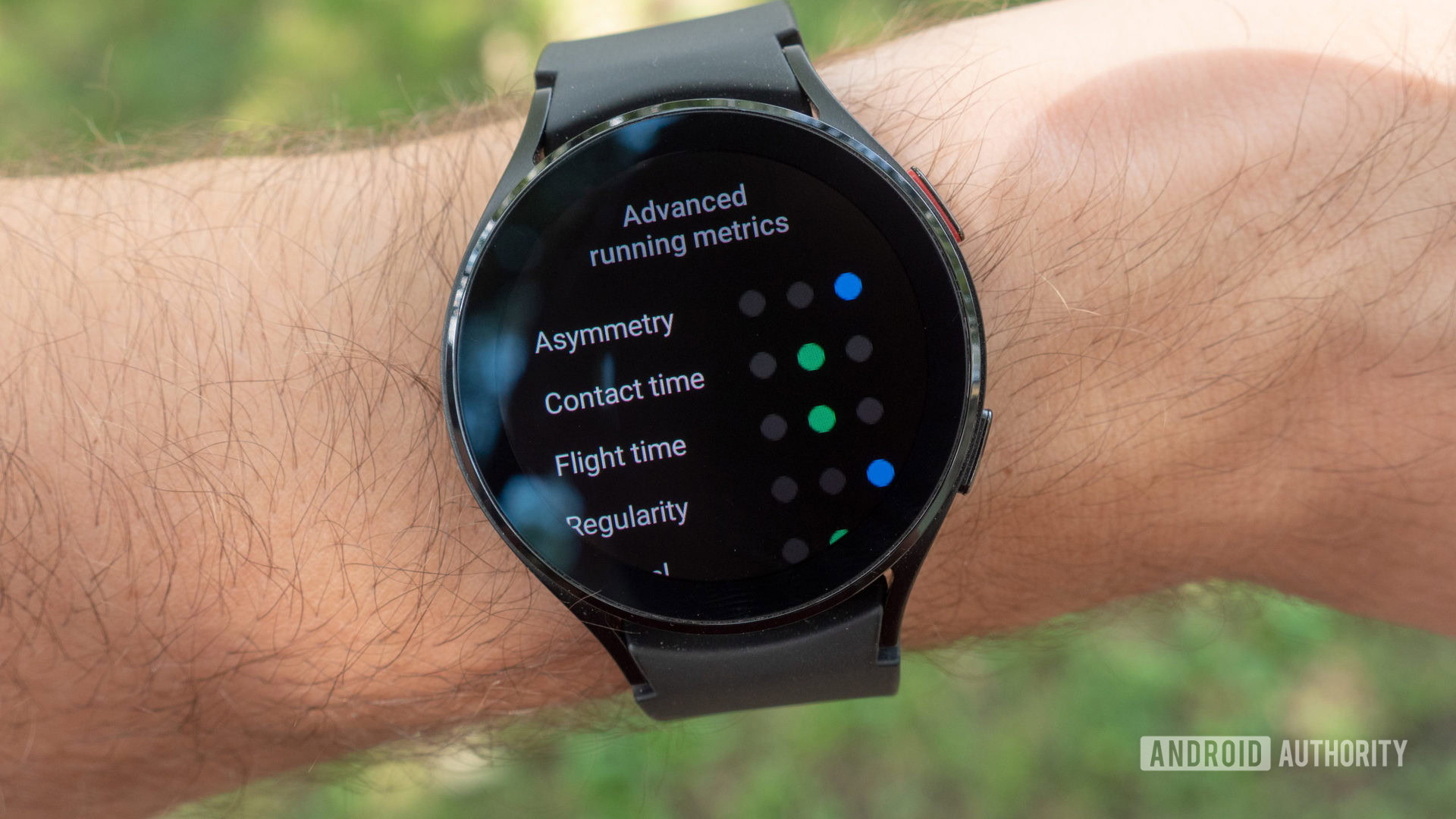 The Samsung Galaxy Watch 4 on a wrist showing advanced running metrics.