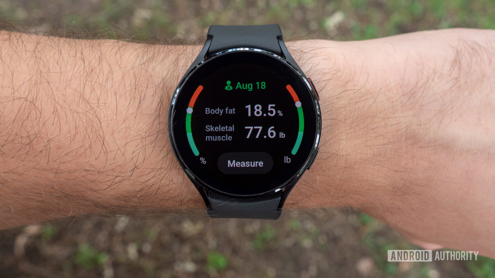 The Samsung Galaxy Watch 4 on a wrist showing body composition analysis.