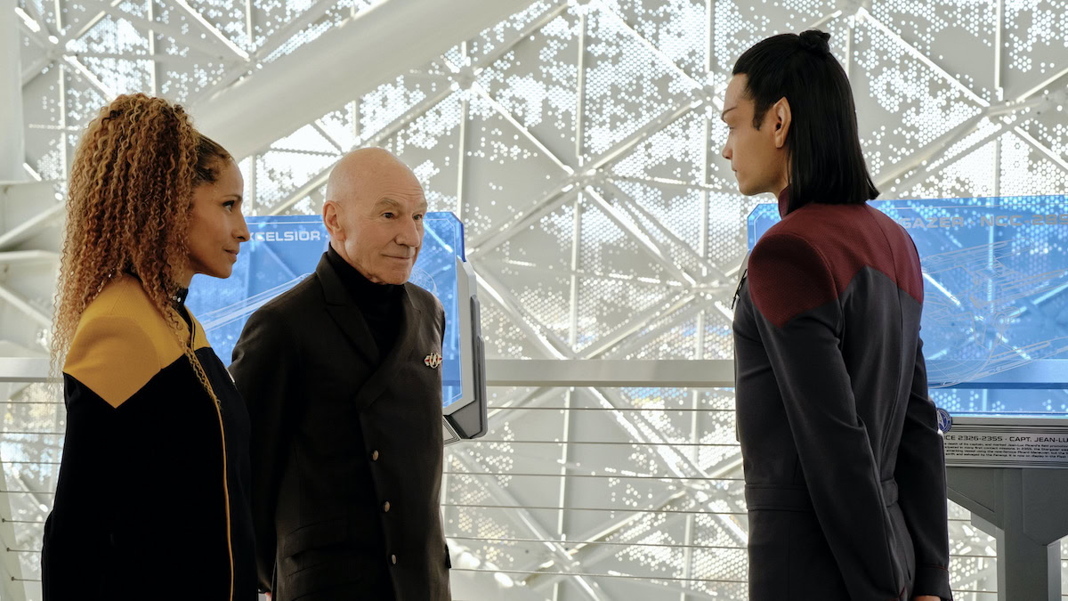 Michelle Hurd as Raffi, Sir Patrick Stewart as Jean-Luc Picard and Evan Evagora as Elnor stand together in Starfleet uniforms in Star Trek: Picard season 2 3