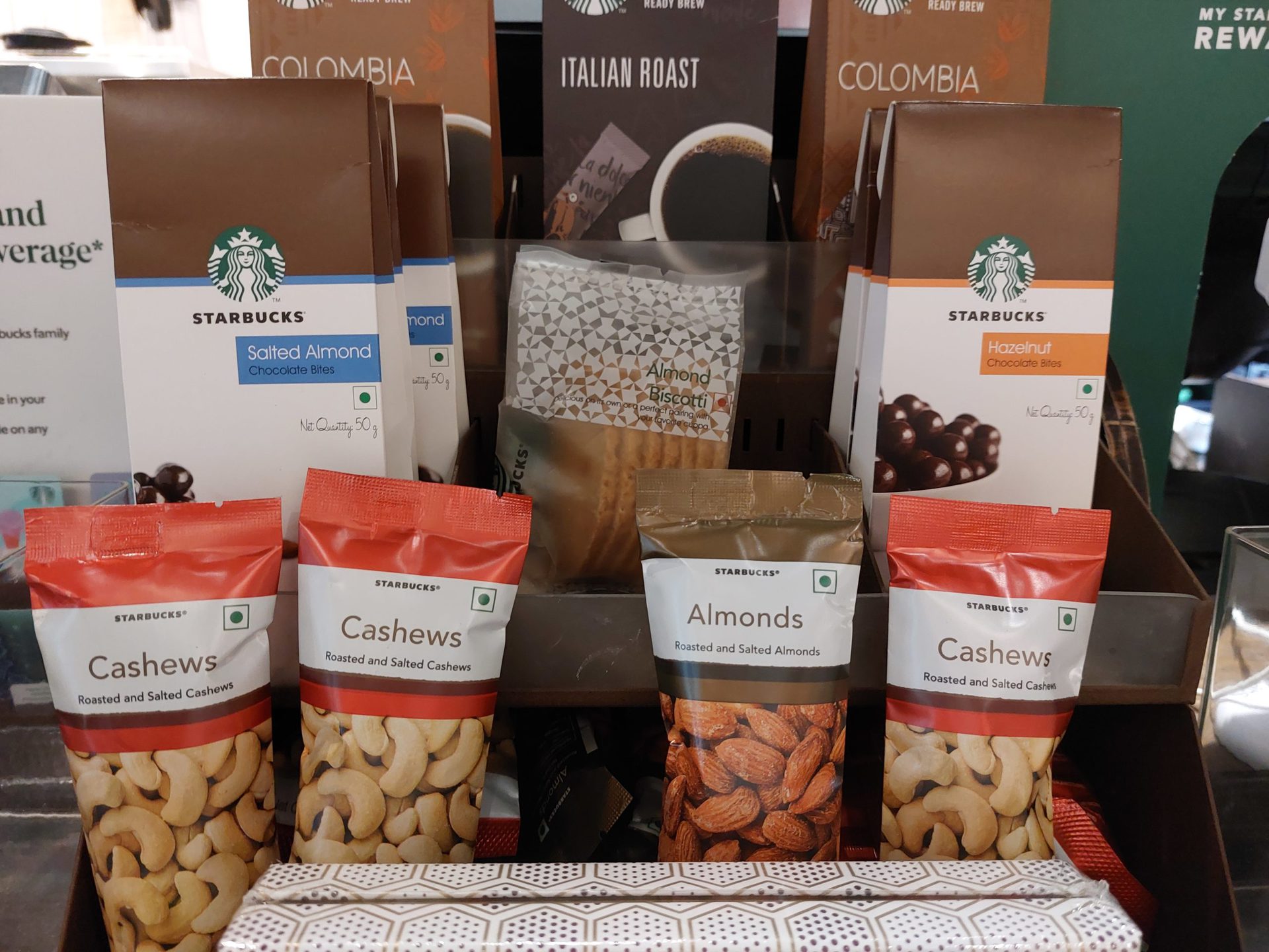 Samsung Galaxy A52s 5G indoor shot at Starbucks showing some nuts and coffee.