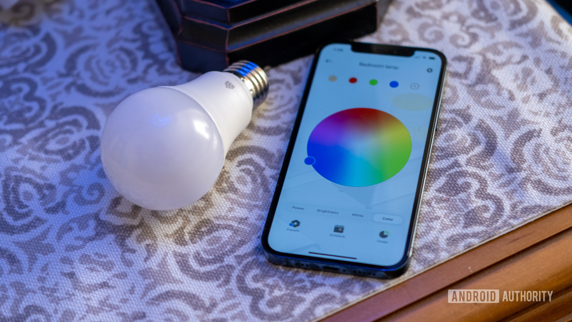 An image of the TP-Link Kasa Smart app under a blue light bulb