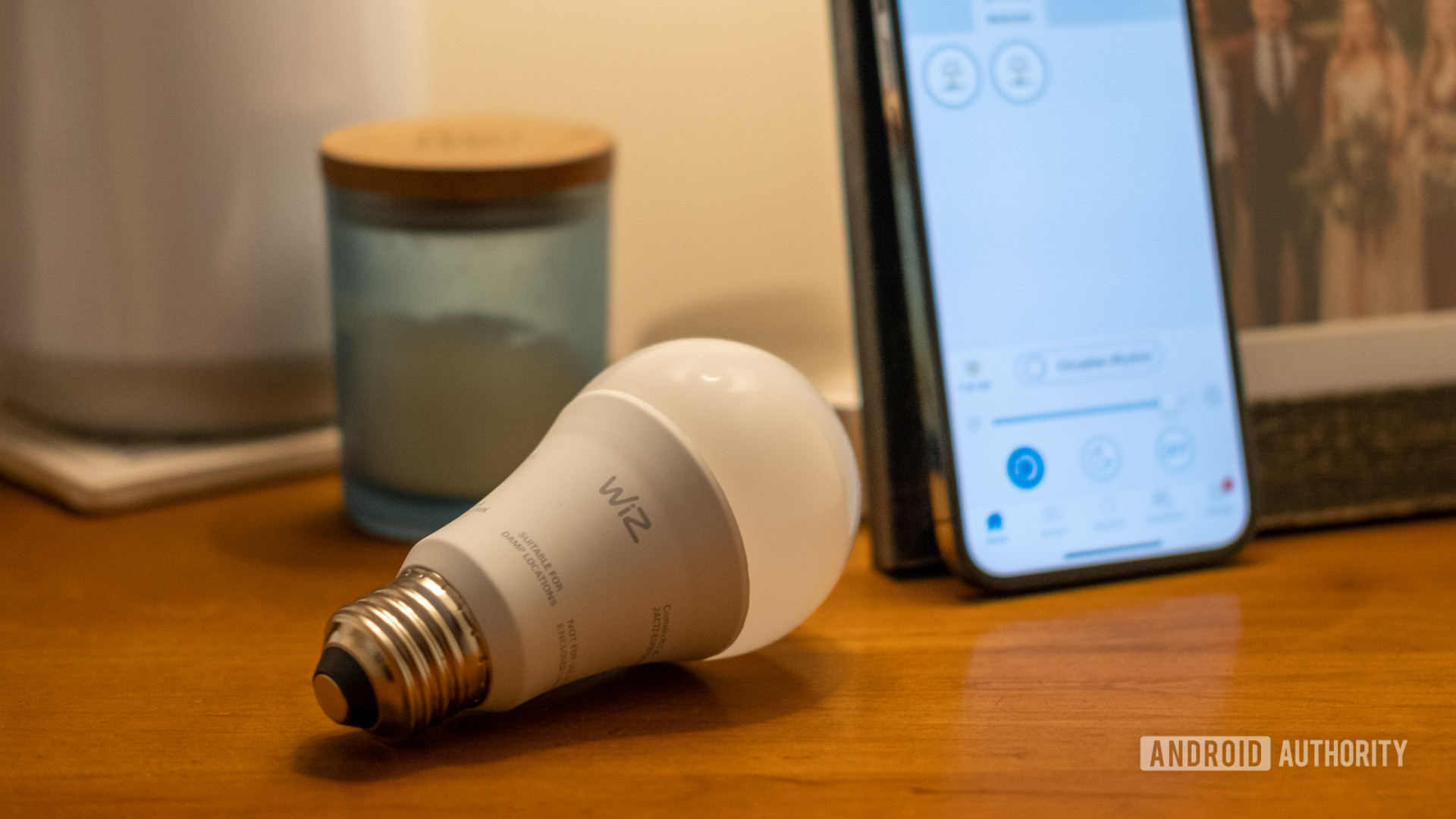 wiz light laying in front of iphone