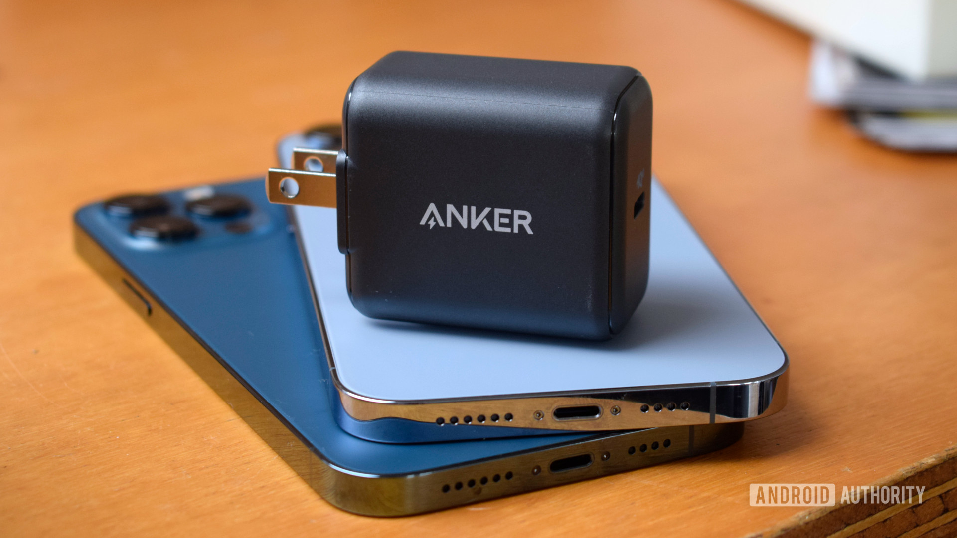 Anker PowerPort III 25W resting on iPhones