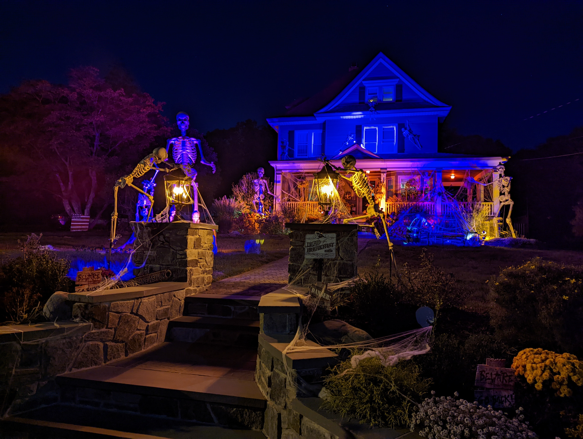 Google Pixel 6 Pro camera sample halloween night shot of the front of a house with lights