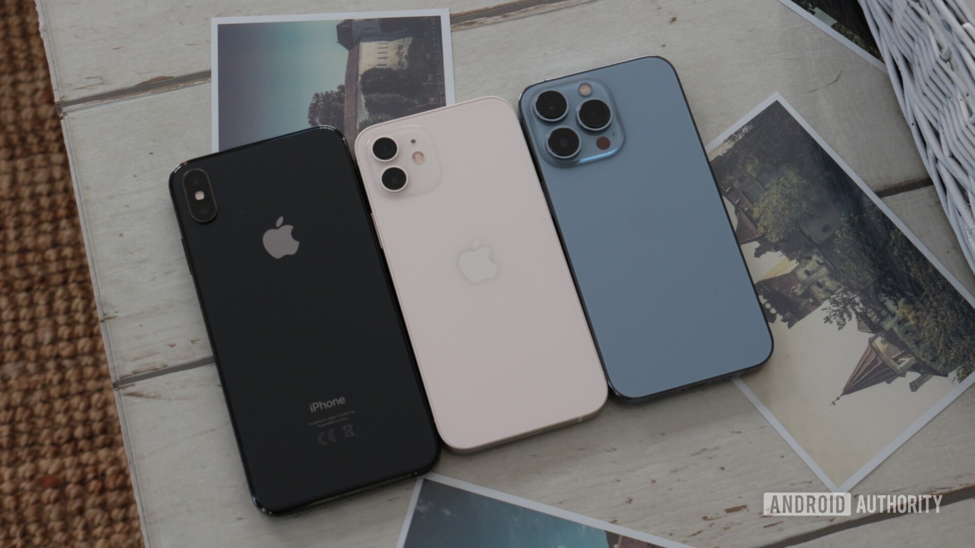 iPhone 13 Pro and iPhone 12 and iPhone XS Max on picture table