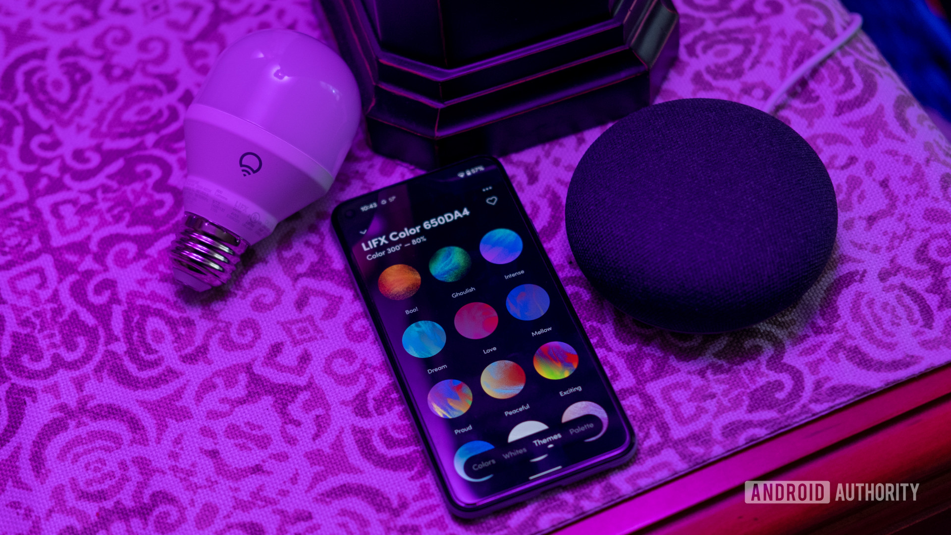 An image of the LIFX Color with the app and Google Home Mini