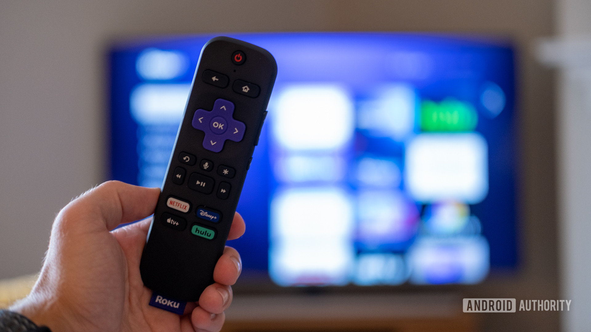 Roku Streaming Stick 4K remote control in front of the TV