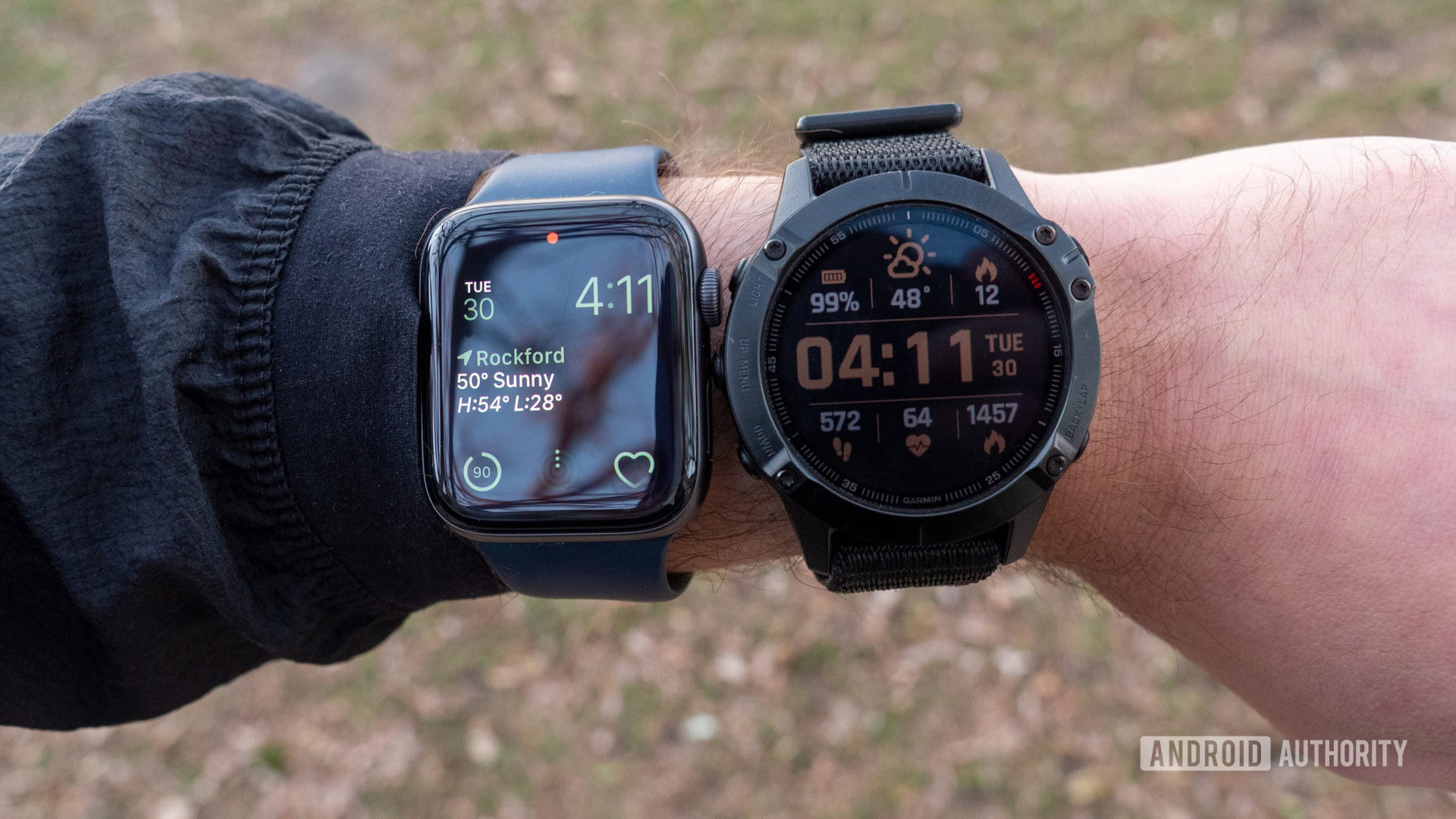 A user compares a Series 7 Apple Watch vs Garmin'a Fenix 6 Pro on wrist.