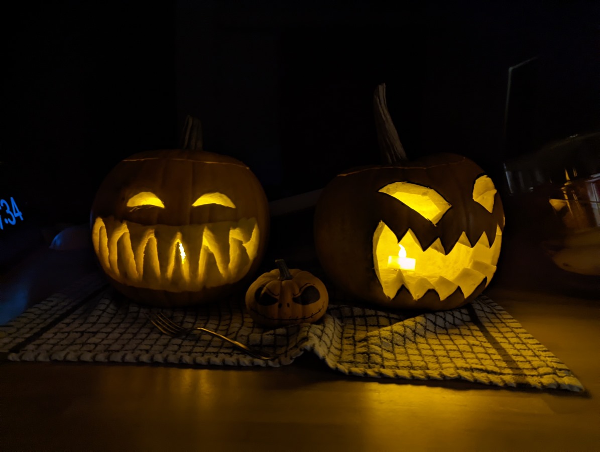 Camera sample dark shot of two carved pumpkins with candles inside in Night Mode Google Pixel 6 Pro