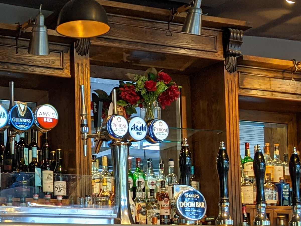 100% crop of a wooden bar and beer taps, shot on the Google Pixel 5