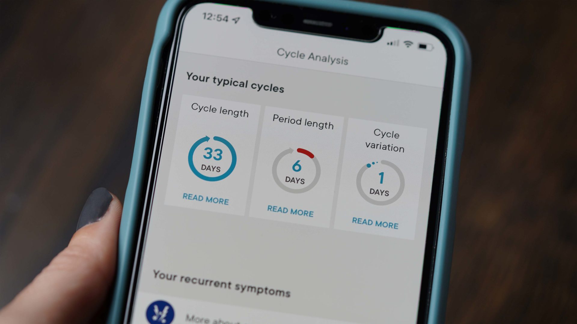 A user reviews their cycle analysis in the Clue period and ovulation tracking app.