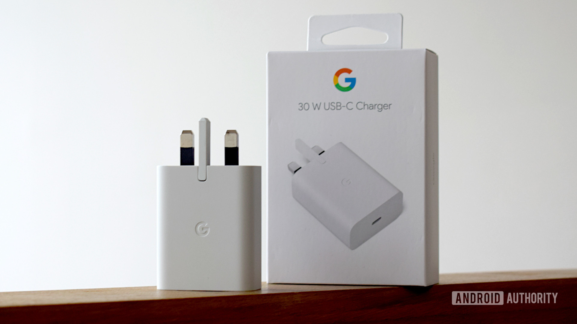 Google 30W USB C Power Charger Upright Next to the Box