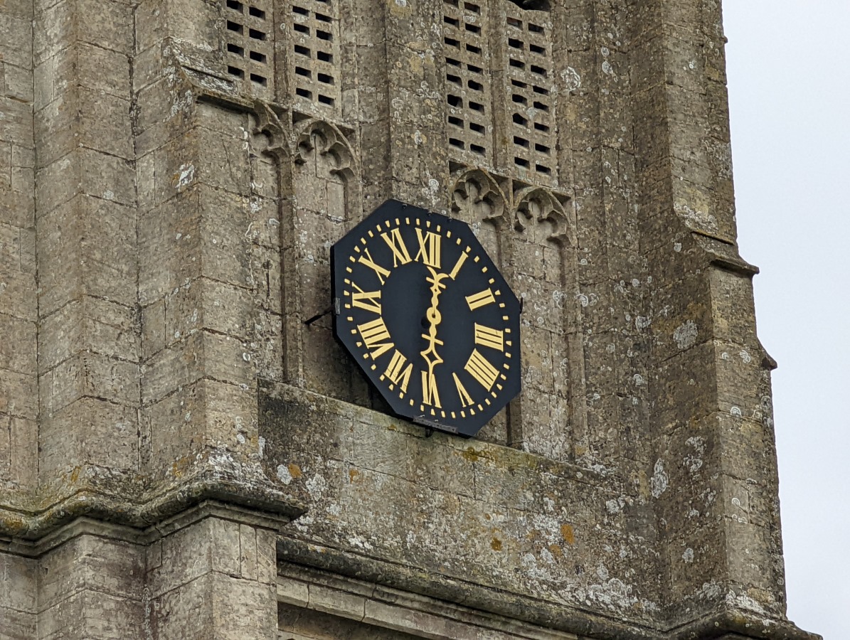 Zoom 10x of a church tower's black and gold clock on the Google Pixel 6 Pro
