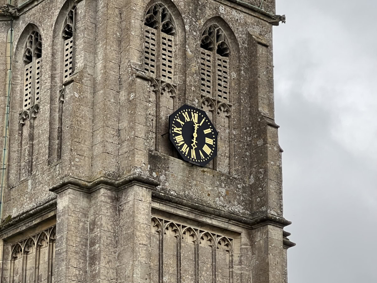 Zoom 5x shot of a church tower with a black and gold clock on the Apple iPhone 13 Pro Max