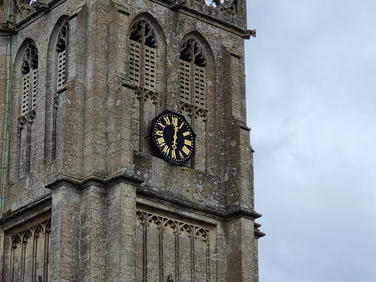 Zoom 5x shot of a church tower with a black and gold clock on the Samsung Galaxy S21 Ultra