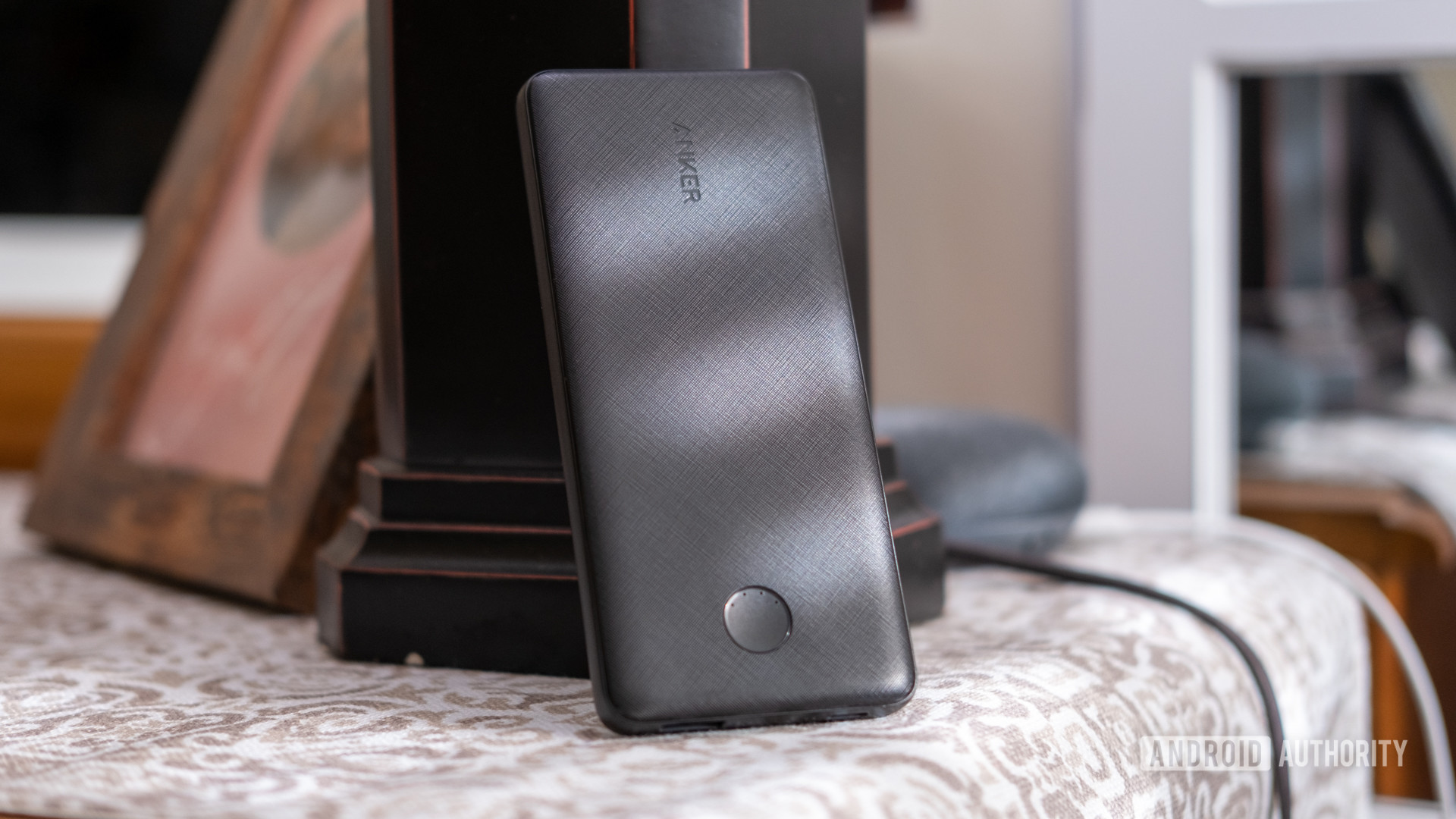 anker powercore slim pd leaning on lamp