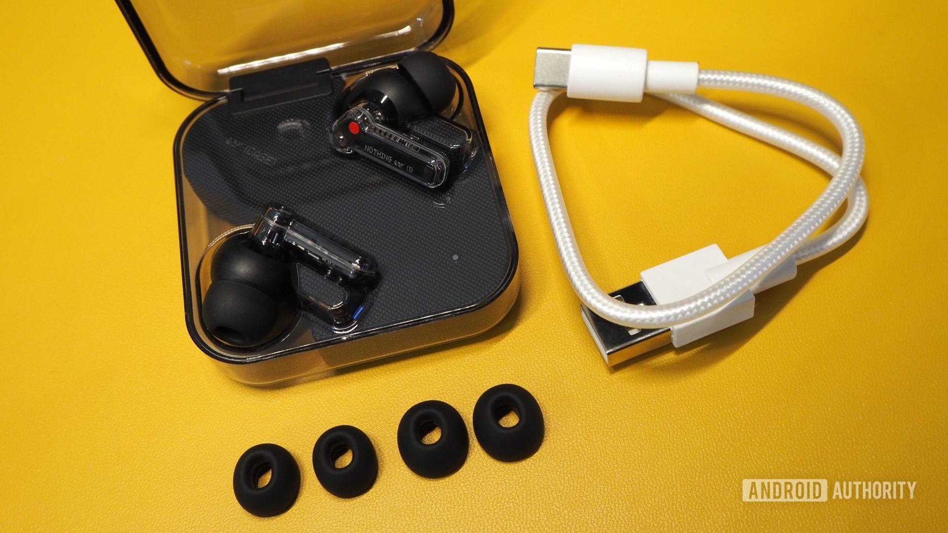Nothing ear (1) black in case with in-box accessories (extra tips and white USB-A to USB-C cable)
