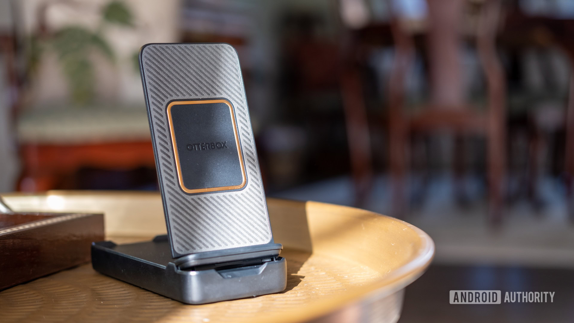 otterbox folding wireless power bank on table