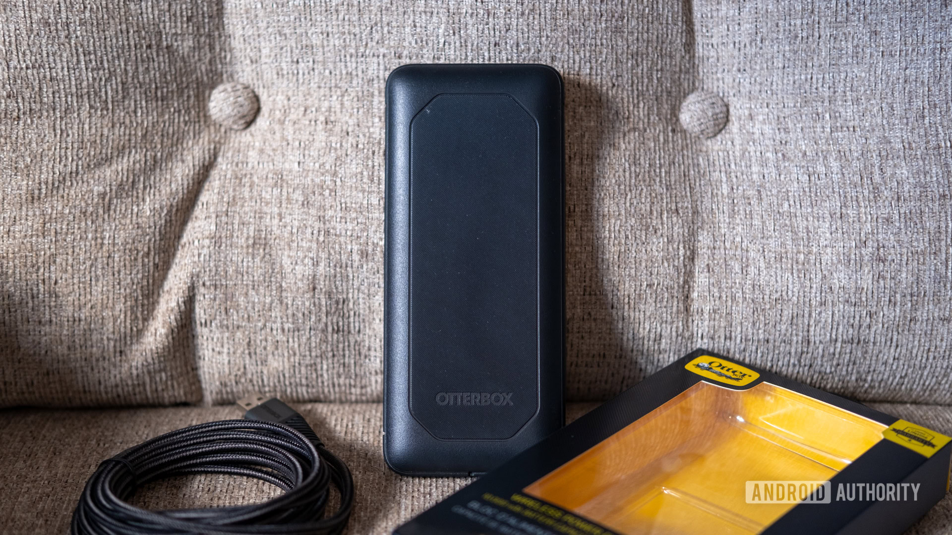 The Otterbox Wireless Power Pack above the cable and charger