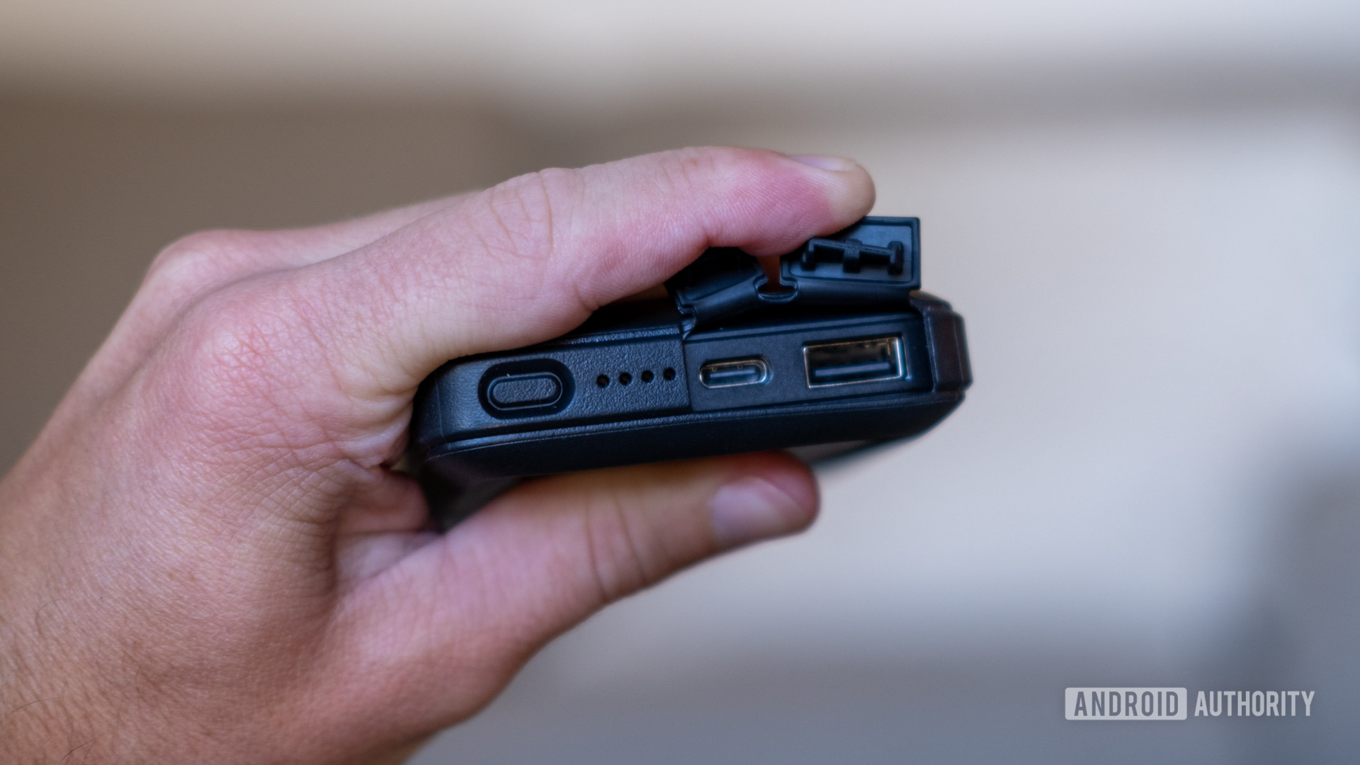 The Otterbox Wireless Power Pack with the port cover open