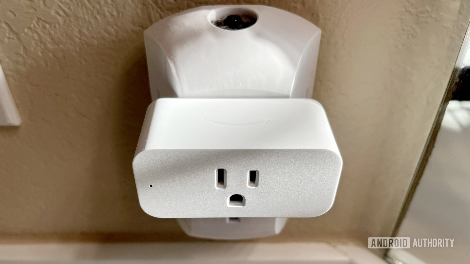A top-down view of the Amazon Smart Plug in a bathroom socket