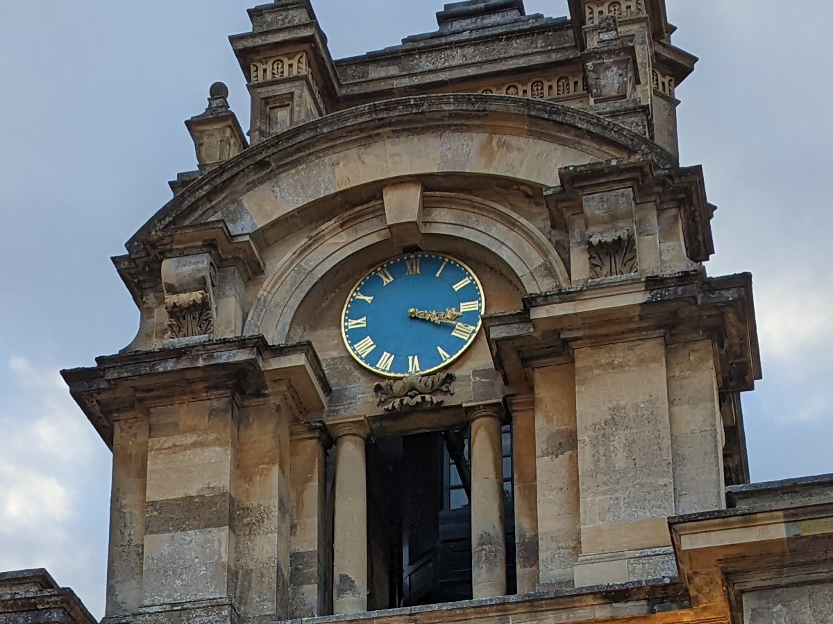 Crop of stone clock tower with blue clock shot on Google Pixel 6 Pro
