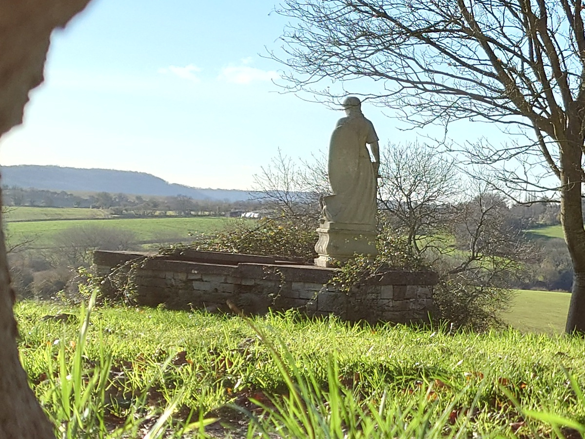 Landscape crop of statue overlooking green hills shot on Sony Xperia 1 III