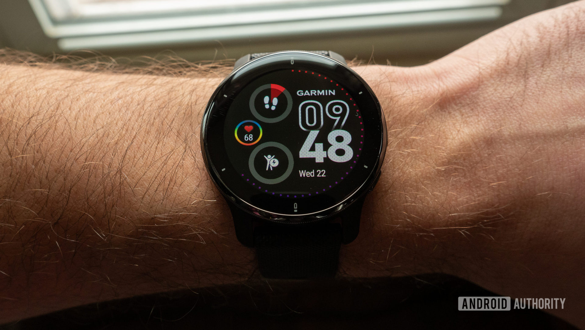 Garmin Venu2 Plus on the wrist, showing the clock face and display