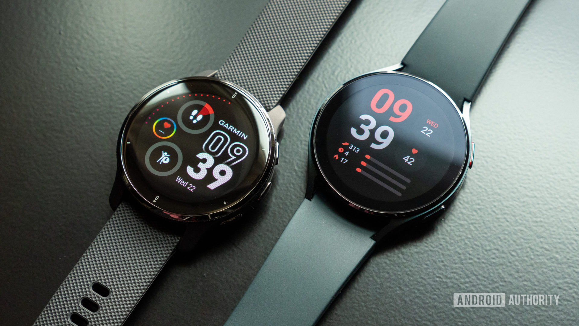 One of Wear OS device's biggest competitors, the Garmin Venu 2 Plus rests alongside a Samsung Galaxy Watch 4.