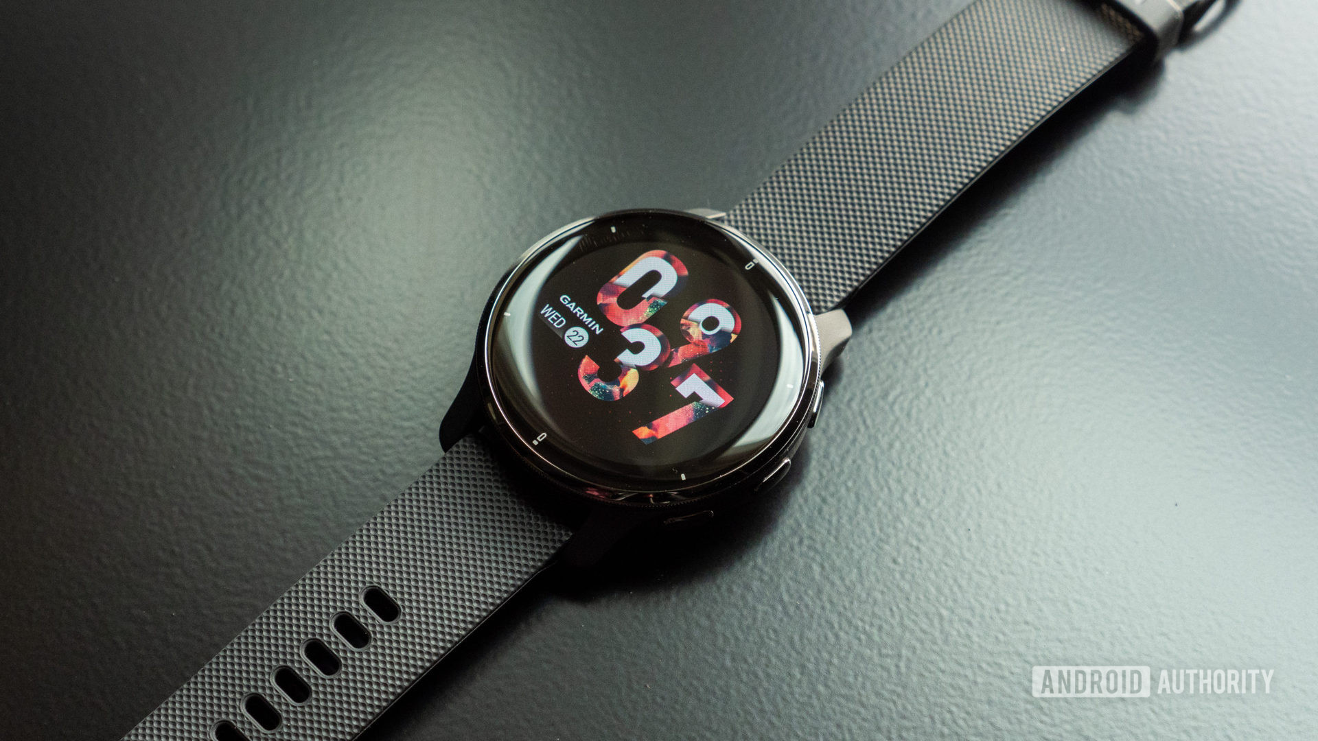 An image of the Garmin Venu 2 Plus on a table showing the display and watch face