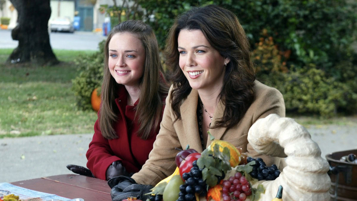 Rory and Lorelei sit outdoors in Gilmore Girls