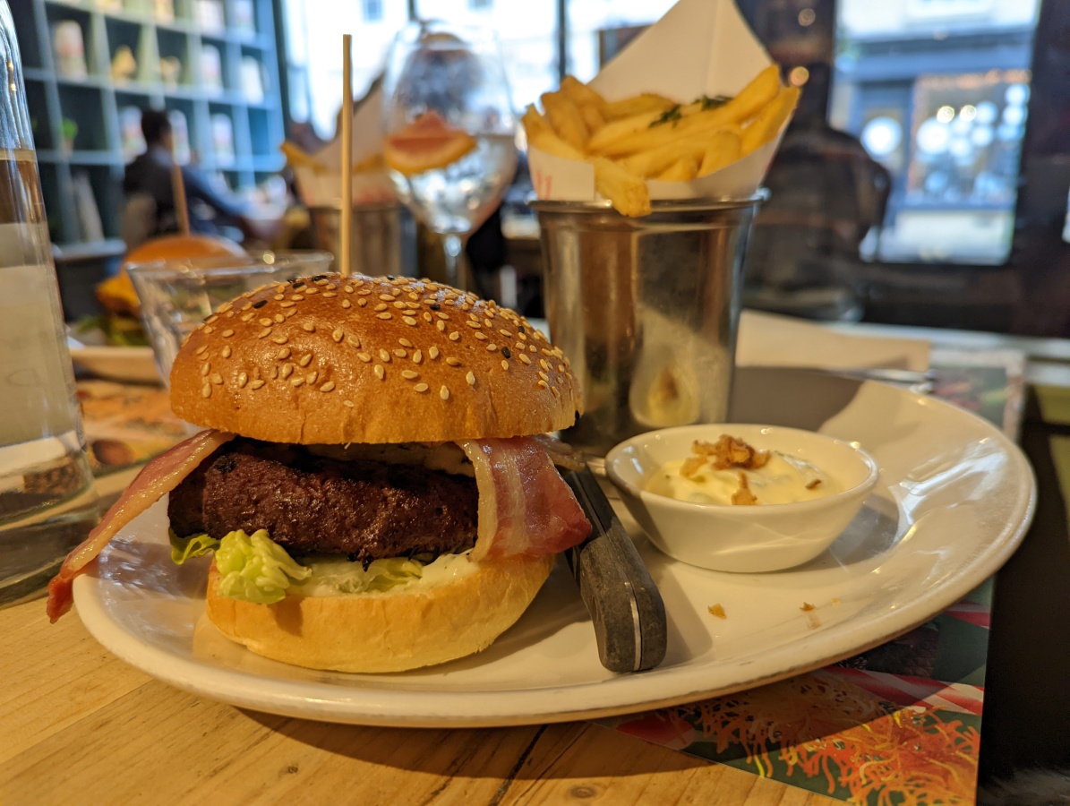 Hamburger and fries on a plate in a restaurant shot on Google Pixel 6 Pro