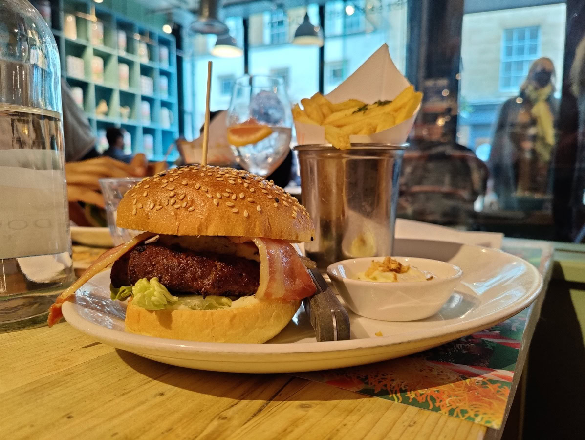 Hamburger and fries on a plate in a restaurant shot on OnePlus 9 Pro