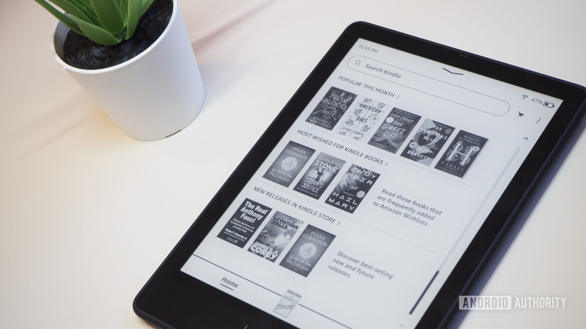 Amazon Kindle Paperwhite 2021 with the screen showing recommended books