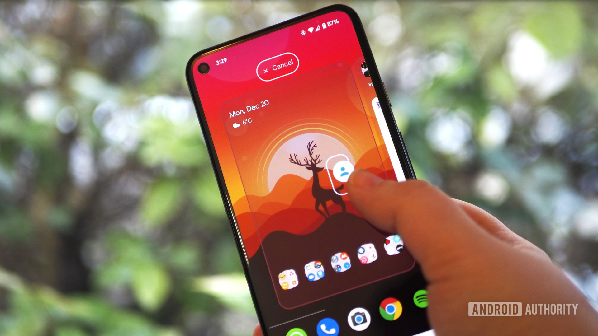 Pixel 5 on a green nature background, showing the launcher homescreen and gesture to break away an in-app shortcut into a separate icon