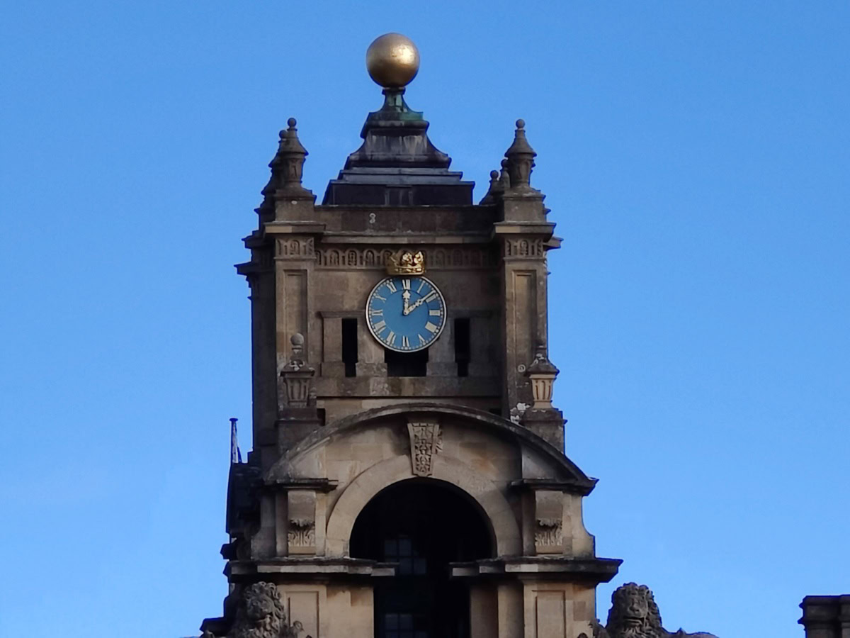 10x zoom of stone clock tower and building shot on OnePlus 9 Pro